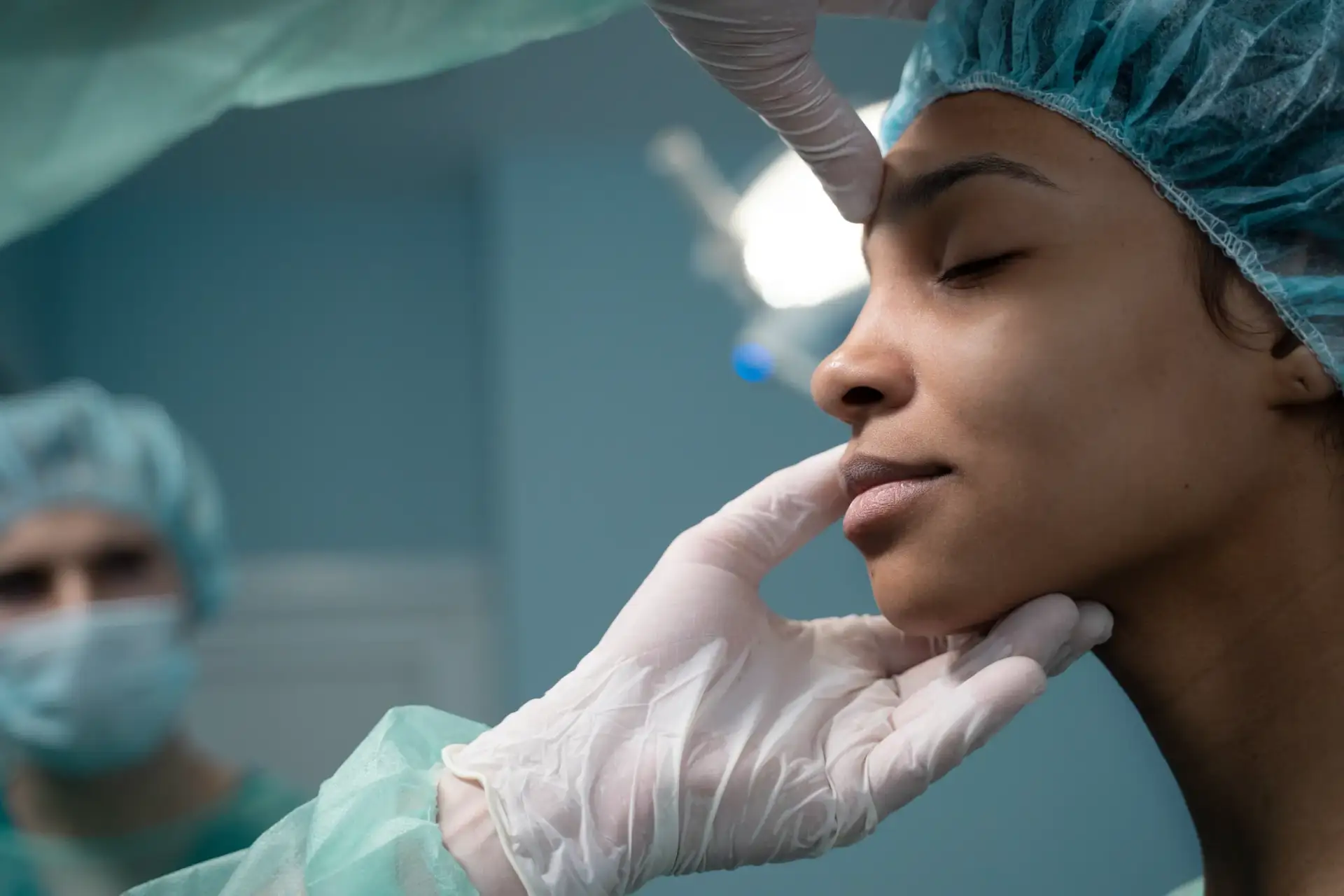 side-view-doctor-checking-patient-before-rhinoplasty